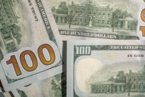 Photo first 100k dollars wealth journey